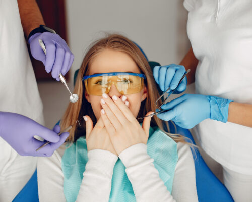 Beautiful lady in the dentist's office. Woman in a uniform